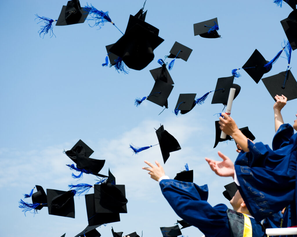 Graduates throwing caps